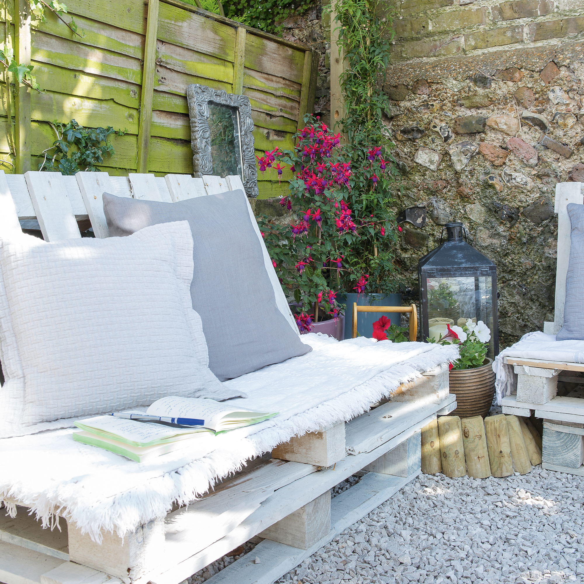 Garden bench made from pallets in gravel garden