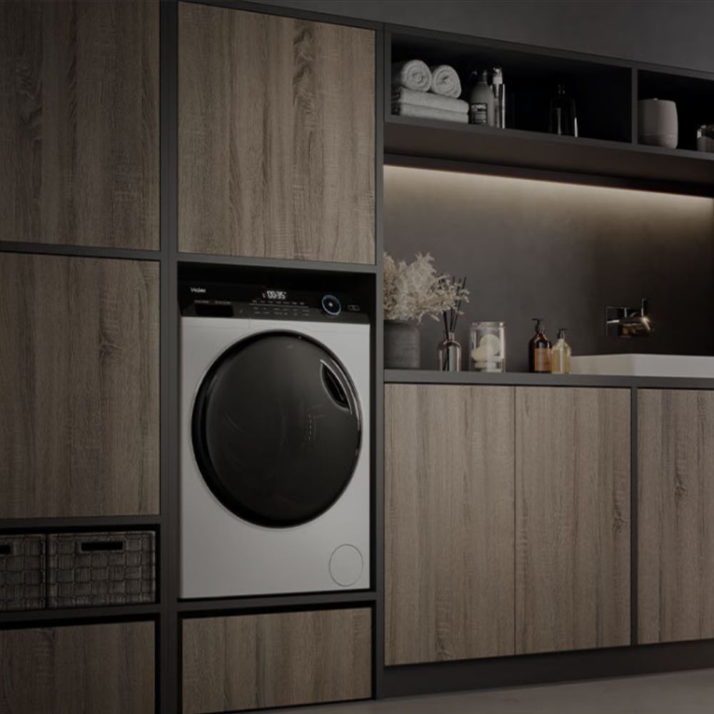 Haier white tumble drier in modern beige and grey kitchen